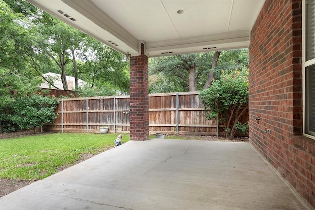 view of patio / terrace featuring fence