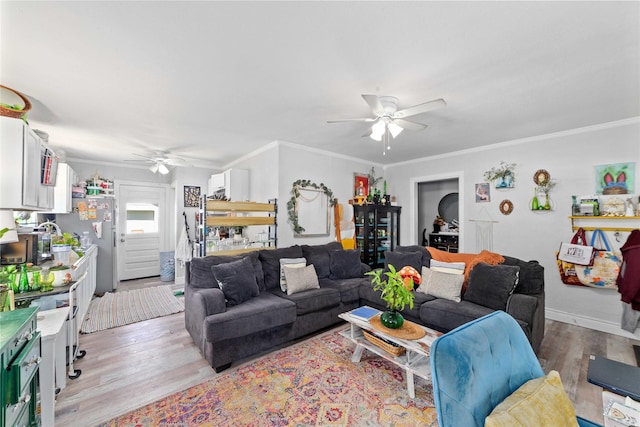 2612 1st St, Brownwood, TX 76801 - living room with ceiling fan, light wood-type flooring, and ornamental molding