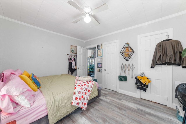 2612 1st St, Brownwood, TX 76801 - bedroom featuring wood finished floors, ornamental molding, and ceiling fan