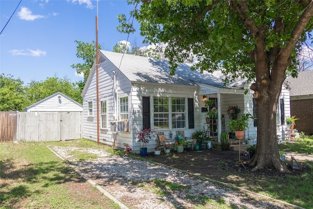 2612 1st St, Brownwood, TX 76801 - view of front of property with fence and roof with shingles