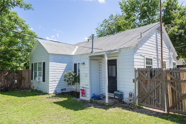 2612 1st St, Brownwood, TX 76801 - rear view of property with a gate, a shingled roof, and crawl space