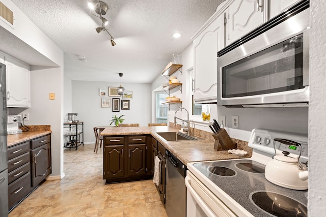 4145 Malone Ave, The Colony, TX 75056 - kitchen with a sink, white range with electric cooktop, white cabinetry, stainless steel microwave, and dishwashing machine