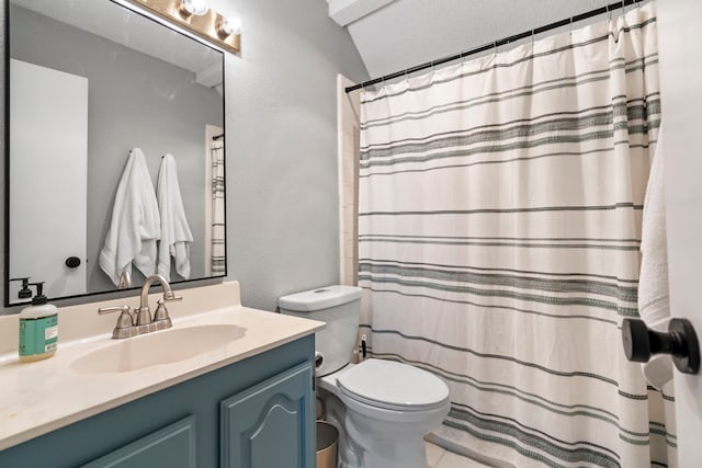4145 Malone Ave, The Colony, TX 75056 - bathroom with toilet, a textured wall, a shower with curtain, and vanity