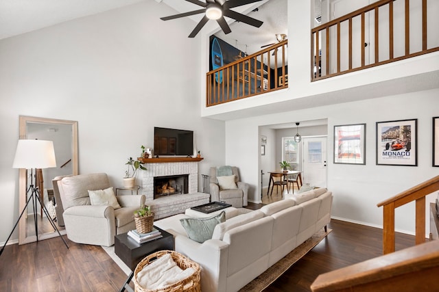 4145 Malone Ave, The Colony, TX 75056 - living room featuring high vaulted ceiling, baseboards, a ceiling fan, and a brick fireplace