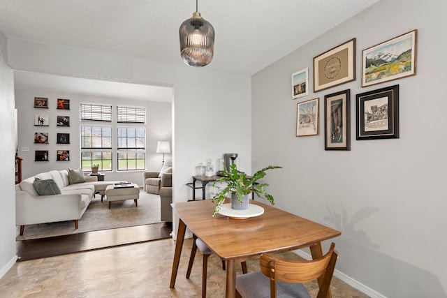 4145 Malone Ave, The Colony, TX 75056 - dining room with baseboards and a textured ceiling