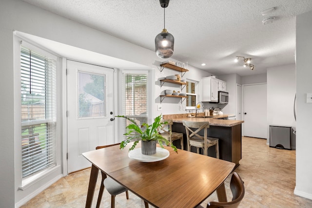 4145 Malone Ave, The Colony, TX 75056 - dining space with a textured ceiling