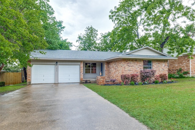 single story home featuring a front yard, brick siding, fence, concrete driveway, and an attached garage