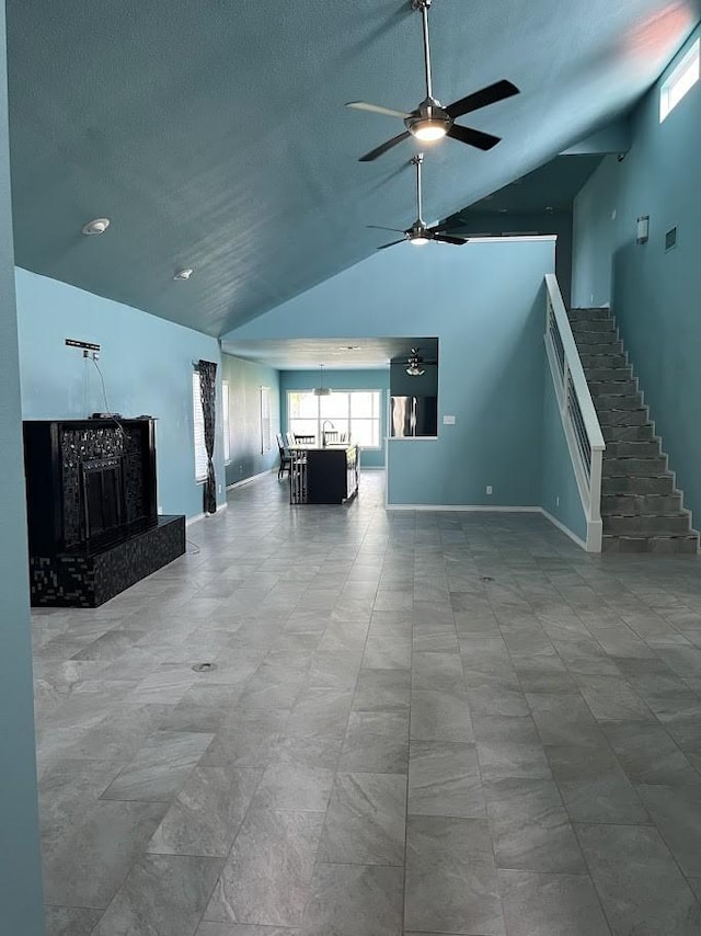 1824 Shady Point Circle Dr, San Angelo, TX 76904 - living area with baseboards, stairway, high vaulted ceiling, ceiling fan with notable chandelier, and a premium fireplace