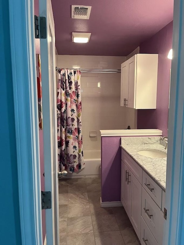 1824 Shady Point Circle Dr, San Angelo, TX 76904 - full bath featuring vanity, visible vents, tile patterned flooring, and shower / tub combo with curtain