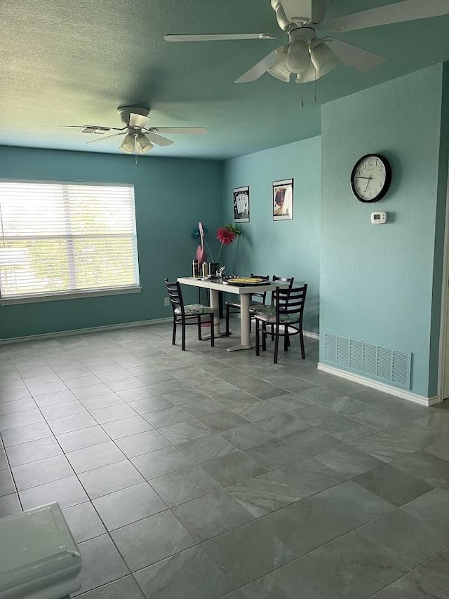 1824 Shady Point Circle Dr, San Angelo, TX 76904 - dining area with visible vents, baseboards, ceiling fan, and tile patterned flooring