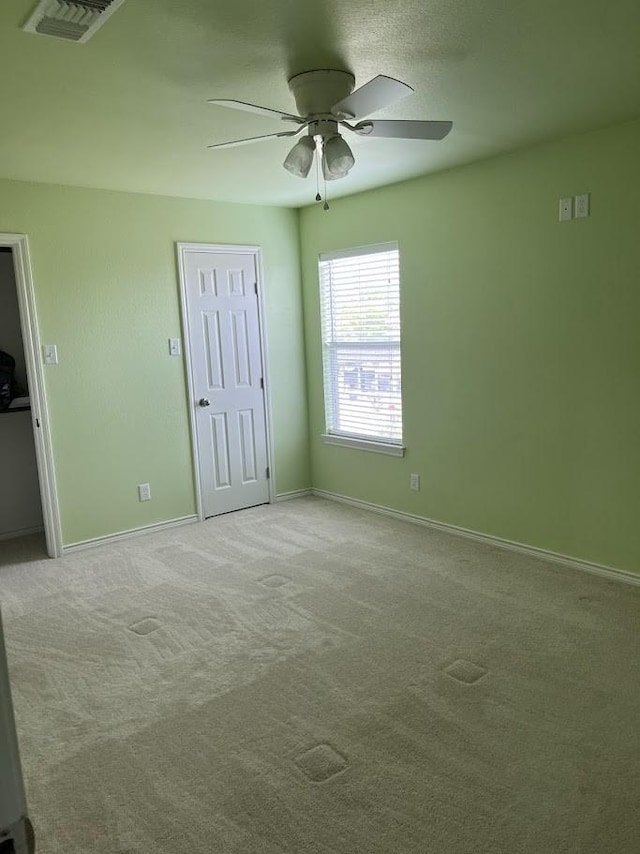 1824 Shady Point Circle Dr, San Angelo, TX 76904 - unfurnished bedroom featuring carpet floors, baseboards, a ceiling fan, and visible vents