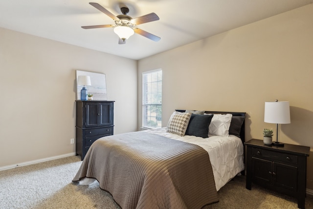 1306 Andrew Ct, Lewisville, TX 75056 - bedroom featuring light carpet, baseboards, and a ceiling fan