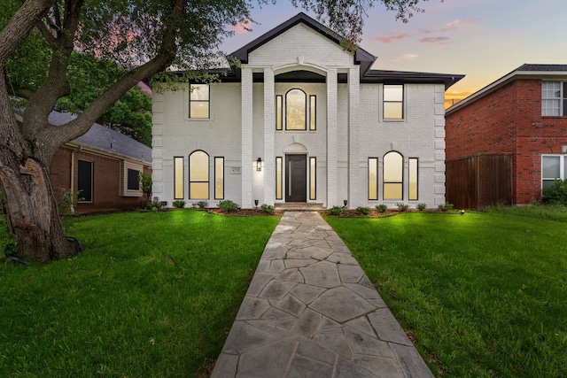 6725 Macintosh Dr, Plano, TX 75023 - neoclassical / greek revival house featuring a lawn, brick siding, and fence