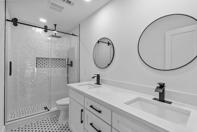 6725 Macintosh Dr, Plano, TX 75023 - bathroom featuring toilet, visible vents, a marble finish shower, and a sink