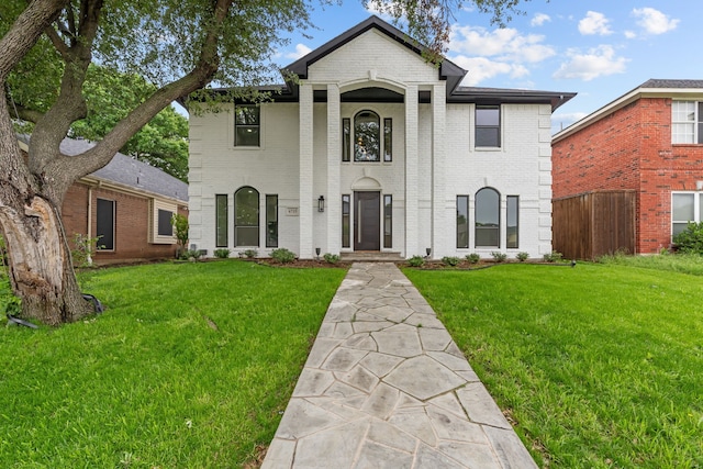 6725 Macintosh Dr, Plano, TX 75023 - greek revival inspired property with brick siding, a front lawn, and fence