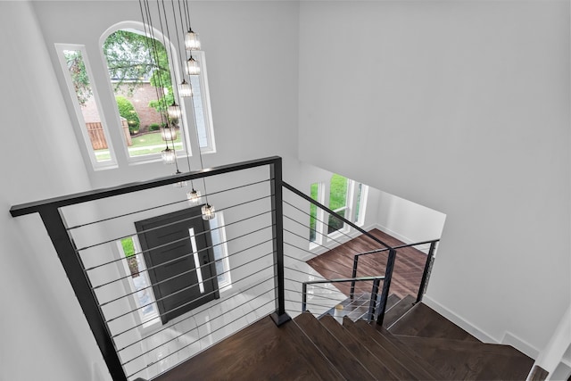 6725 Macintosh Dr, Plano, TX 75023 - staircase featuring baseboards and wood finished floors