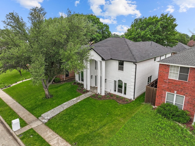 6725 Macintosh Dr, Plano, TX 75023 - view of front of property with a shingled roof, a front yard, and stucco siding