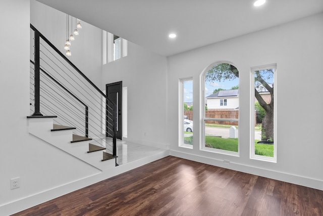 6725 Macintosh Dr, Plano, TX 75023 - entrance foyer featuring baseboards, recessed lighting, stairs, and wood finished floors