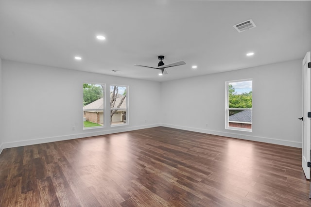 6725 Macintosh Dr, Plano, TX 75023 - unfurnished room with a ceiling fan, baseboards, visible vents, and dark wood-type flooring