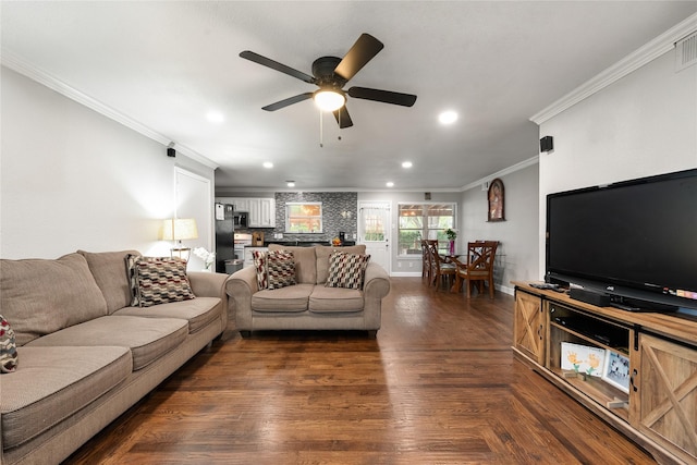 living area with a ceiling fan, visible vents, crown molding, baseboards, and recessed lighting