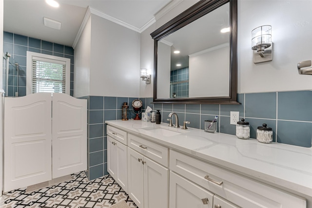 full bath featuring tile walls, ornamental molding, tiled shower, and vanity