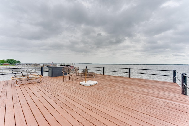 wooden deck with a water view
