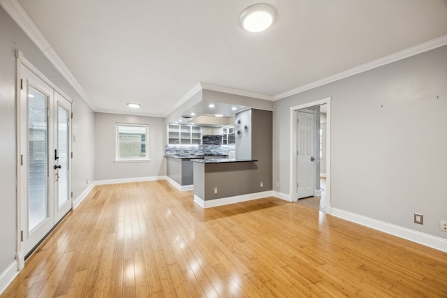9661 Lynbrook Dr, Dallas, TX 75238 - unfurnished living room with light wood-style floors, baseboards, and ornamental molding