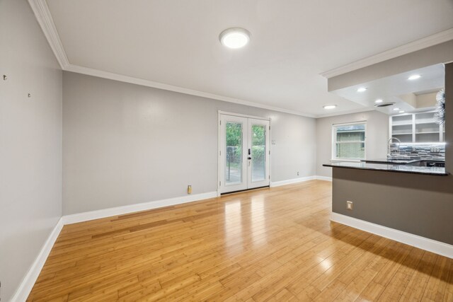 9661 Lynbrook Dr, Dallas, TX 75238 - unfurnished living room with crown molding, baseboards, recessed lighting, french doors, and light wood finished floors