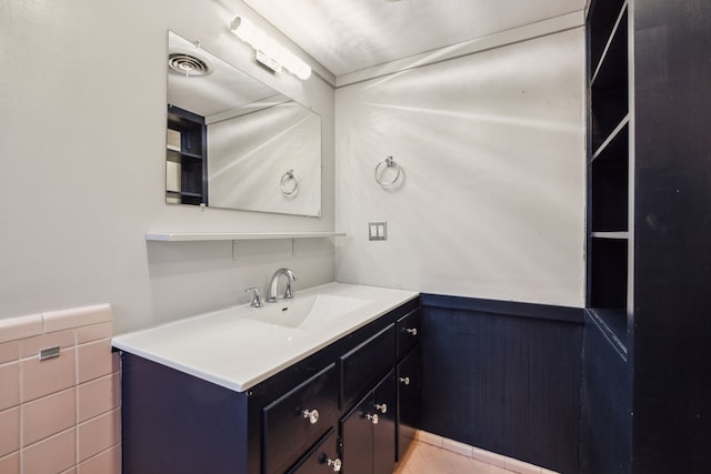 9661 Lynbrook Dr, Dallas, TX 75238 - bathroom with vanity, a wainscoted wall, and visible vents