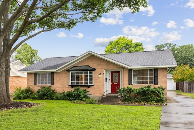 9661 Lynbrook Dr, Dallas, TX 75238 - view of front facade with brick siding, an outbuilding, roof with shingles, and a front lawn