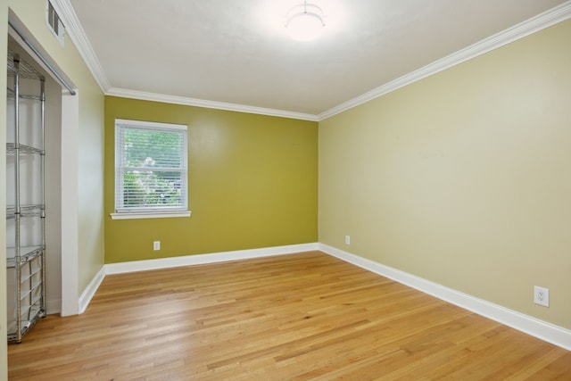 9661 Lynbrook Dr, Dallas, TX 75238 - unfurnished bedroom with crown molding, visible vents, and light wood-style floors