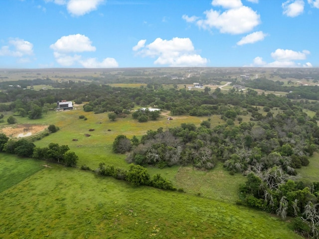 birds eye view of property with a rural view