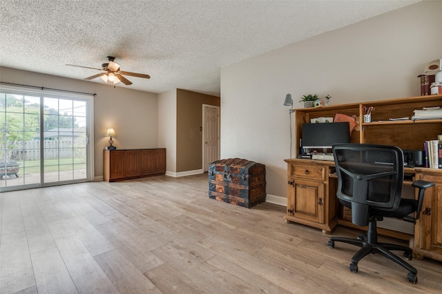 office featuring ceiling fan, a textured ceiling, light wood-style floors, and baseboards