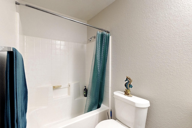full bathroom with toilet, a textured wall, and shower / bath combo with shower curtain