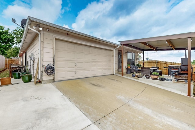 detached garage featuring fence
