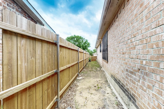 view of property exterior with brick siding