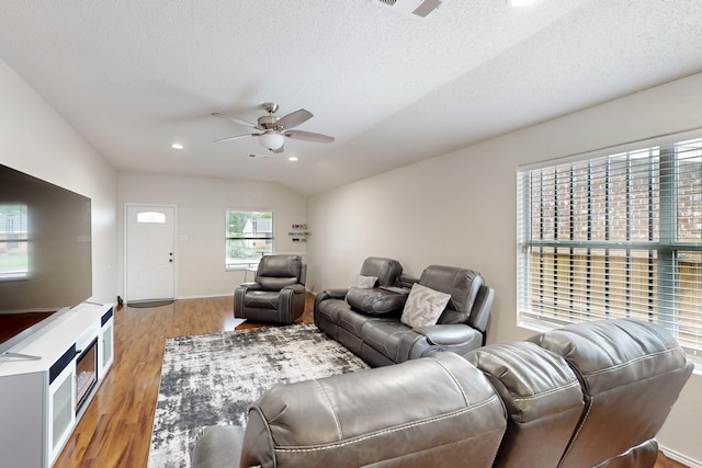 living room featuring wood finished floors, recessed lighting, a textured ceiling, a ceiling fan, and vaulted ceiling