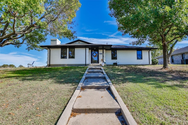 1076 N Cedar St, Muenster, TX 76252 - view of front of property featuring a chimney and a front lawn