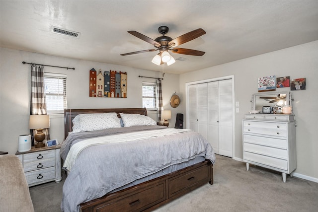 1076 N Cedar St, Muenster, TX 76252 - bedroom featuring a ceiling fan, visible vents, baseboards, a closet, and light carpet