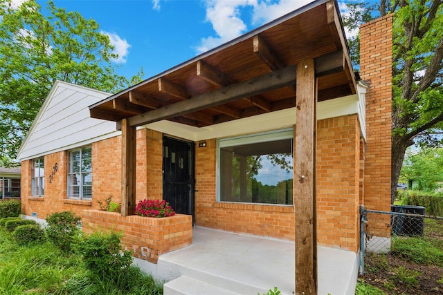 2136 Van Cleave Dr, Dallas, TX 75216 - property entrance with fence, central AC, and brick siding