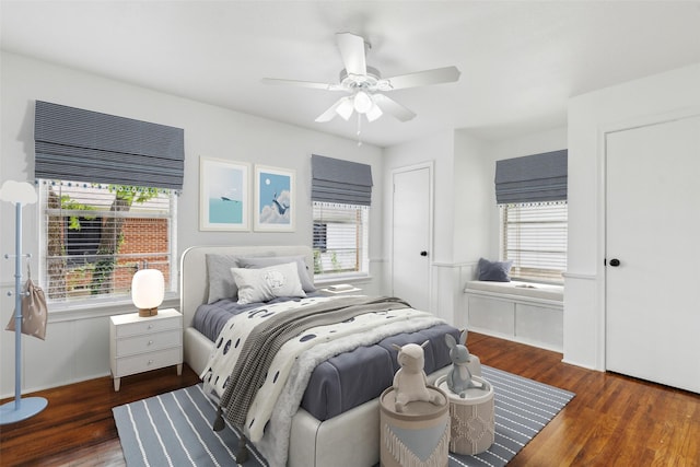 2136 Van Cleave Dr, Dallas, TX 75216 - bedroom featuring multiple windows, a ceiling fan, and wood finished floors