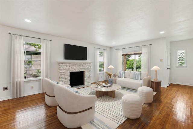 2136 Van Cleave Dr, Dallas, TX 75216 - living room with baseboards, recessed lighting, a brick fireplace, and wood finished floors