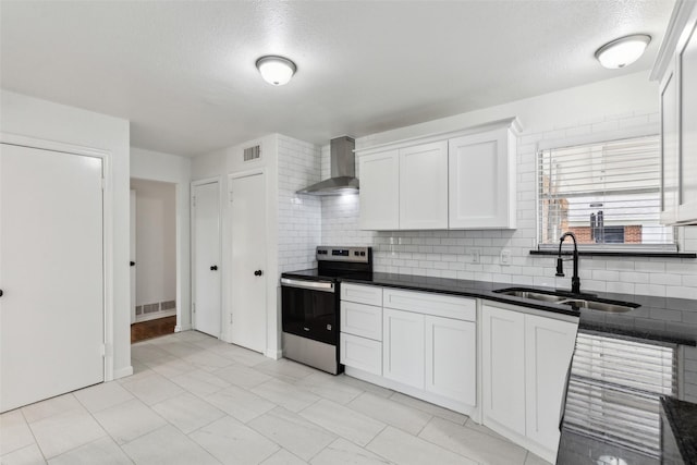 2136 Van Cleave Dr, Dallas, TX 75216 - kitchen with wall chimney range hood, a sink, electric stove, decorative backsplash, and visible vents