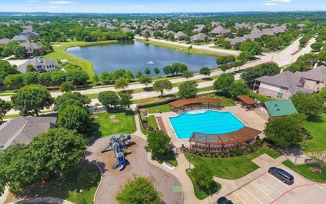 drone / aerial view with a water view and a residential view