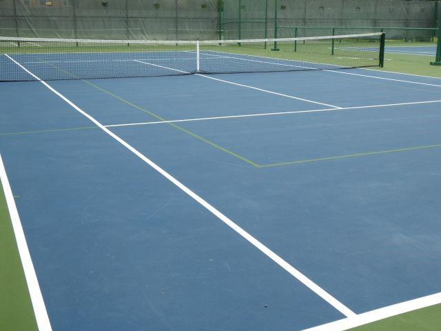 view of tennis court with fence