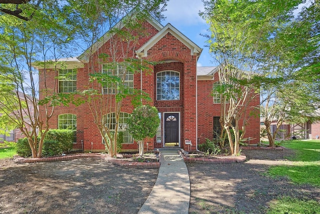 view of front of home featuring brick siding