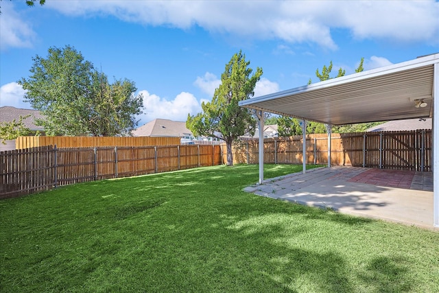 view of yard with a patio and a fenced backyard