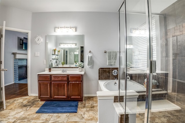 10228 Crawford Farms Dr, Fort Worth, TX 76244 - full bath featuring vanity, a bath, a tiled fireplace, and a shower with door