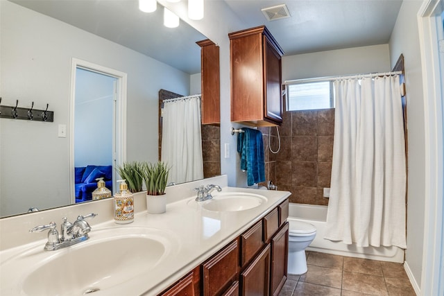 10228 Crawford Farms Dr, Fort Worth, TX 76244 - bathroom with double vanity, toilet, tile patterned flooring, and shower / bath combo