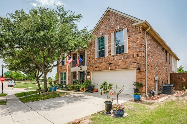 10228 Crawford Farms Dr, Fort Worth, TX 76244 - view of front of property featuring an attached garage, brick siding, driveway, and cooling unit